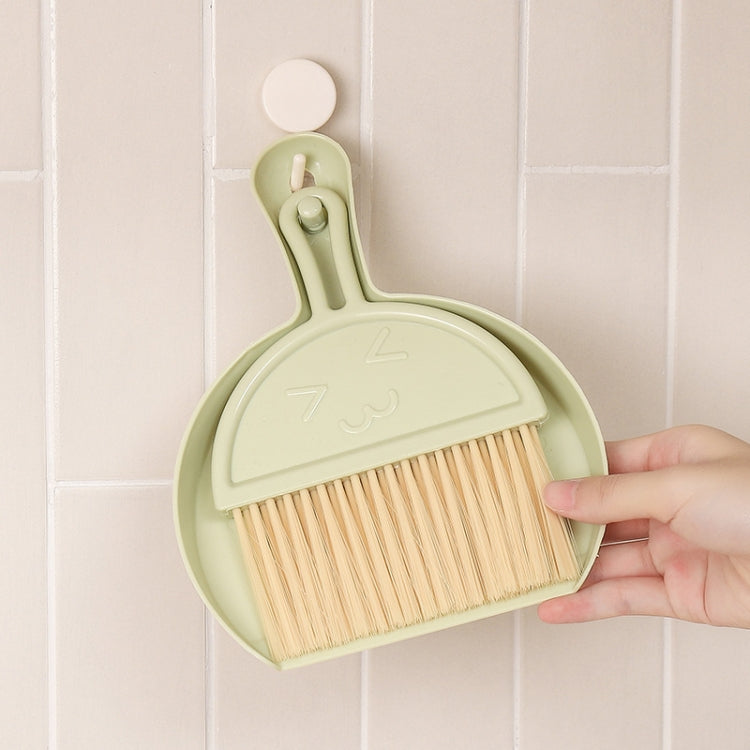 A green mini keyboard cleaning brush set with dustpan, featuring nylon bristles and a compact design for efficient cleaning.