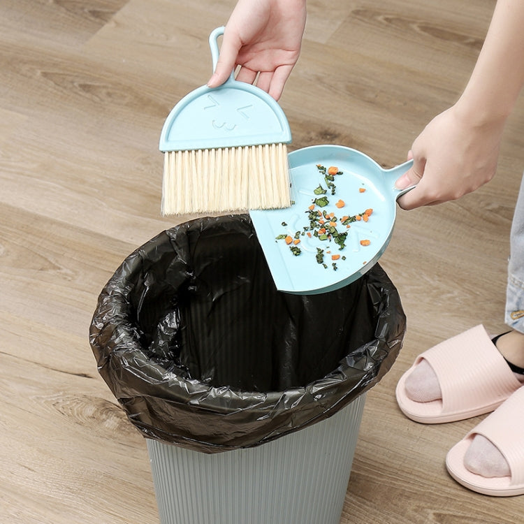A green mini keyboard cleaning brush set with dustpan, featuring nylon bristles and a compact design for efficient cleaning.