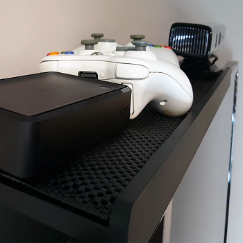 Add-A-Shelf™ T.V. Topper Shelf Large Size mounted on a flat screen TV, showcasing its sleek design and functionality.