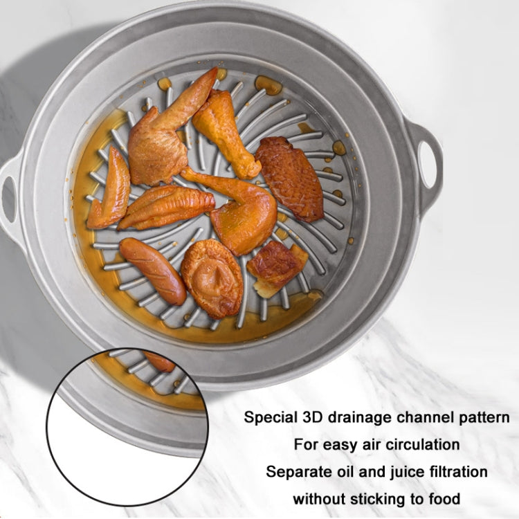High temperature resistant silicone baking tray for air fryers, featuring a 3D drainage groove pattern and double ear carry handles.