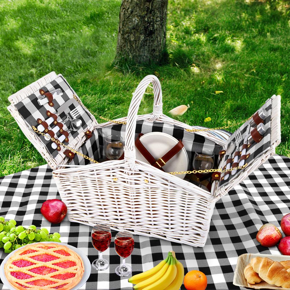 Alfresco 2 Person Picnic Basket with accessories including cutlery, plates, and a matching blanket, perfect for outdoor dining.