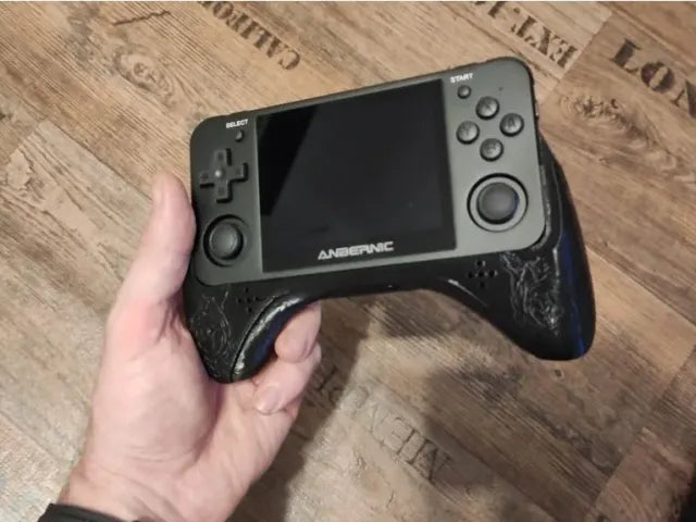 Anbernic RG351MP Game Pad 'Epic ULTRA' in black with stylish circuit pattern and Anbernic logo.