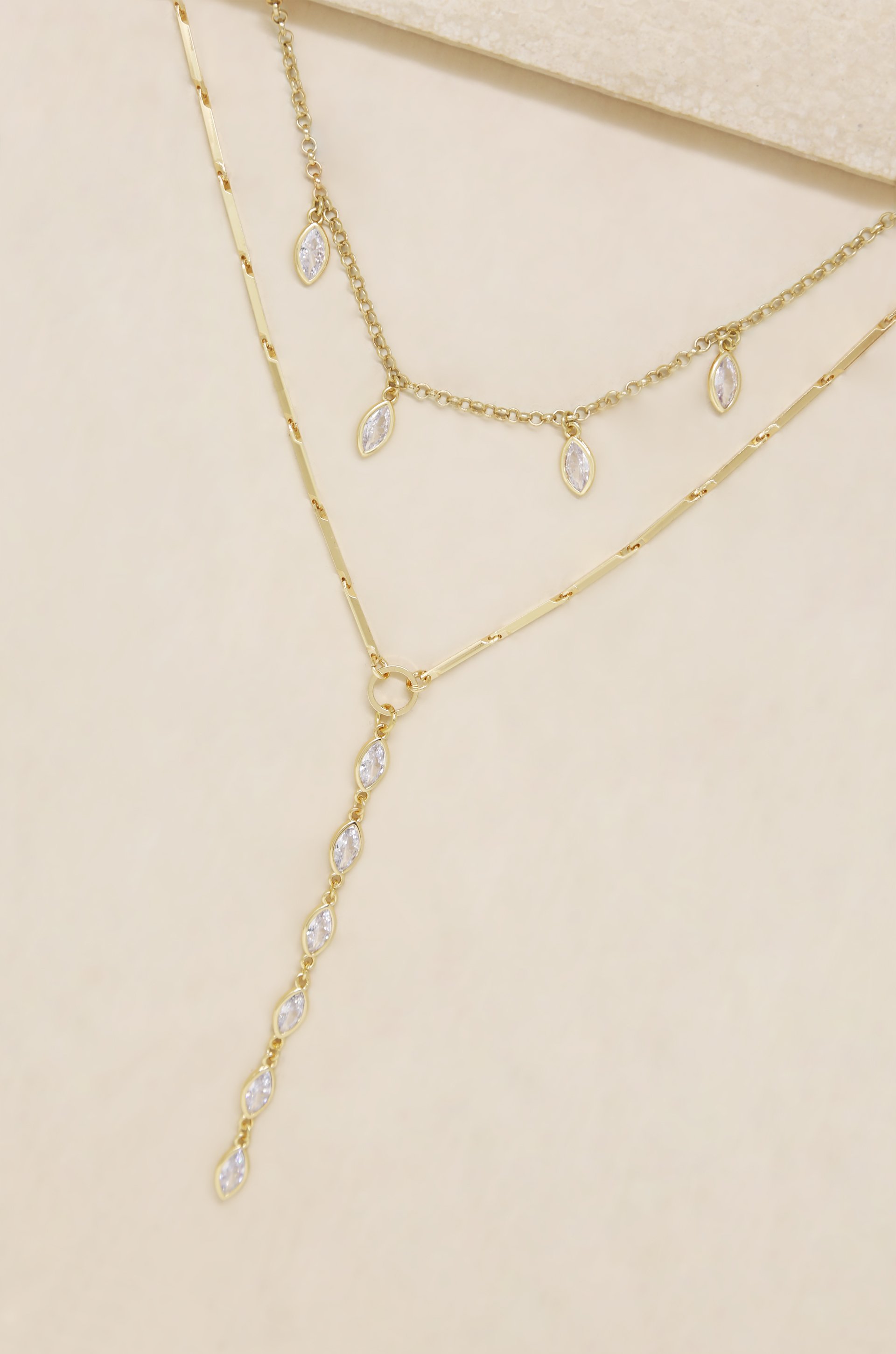 Ariella Glass Crystal 18k Gold Plated Layered Lariat Necklace featuring two elegant layers with sparkling cubic zirconia accents.