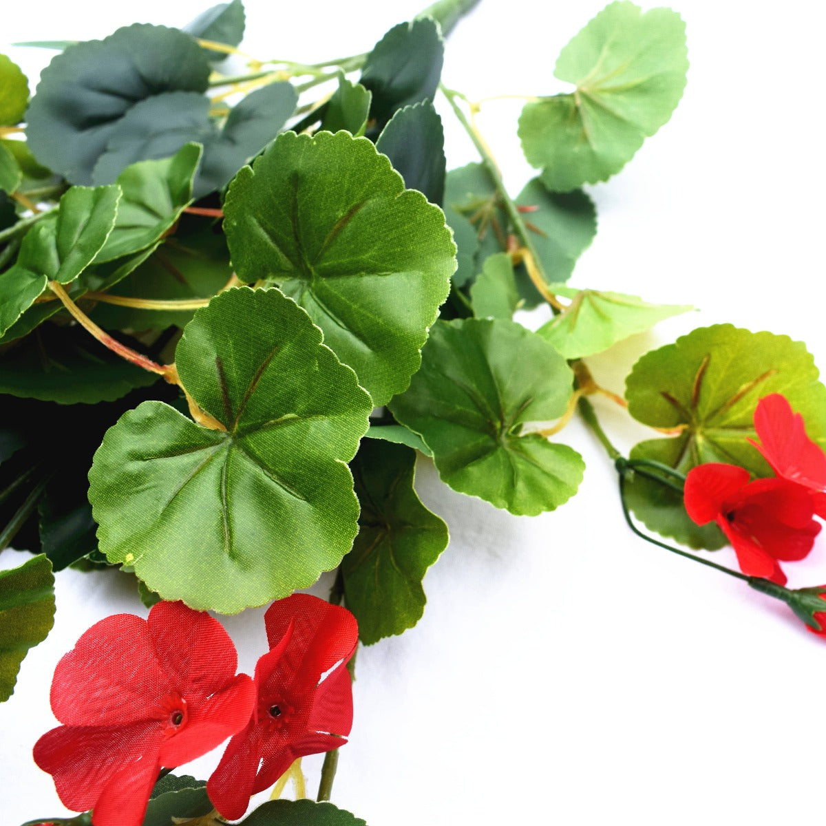 60cm Artificial Geranium Hanging Bush with vibrant red flowers and lush green leaves, perfect for indoor decoration.