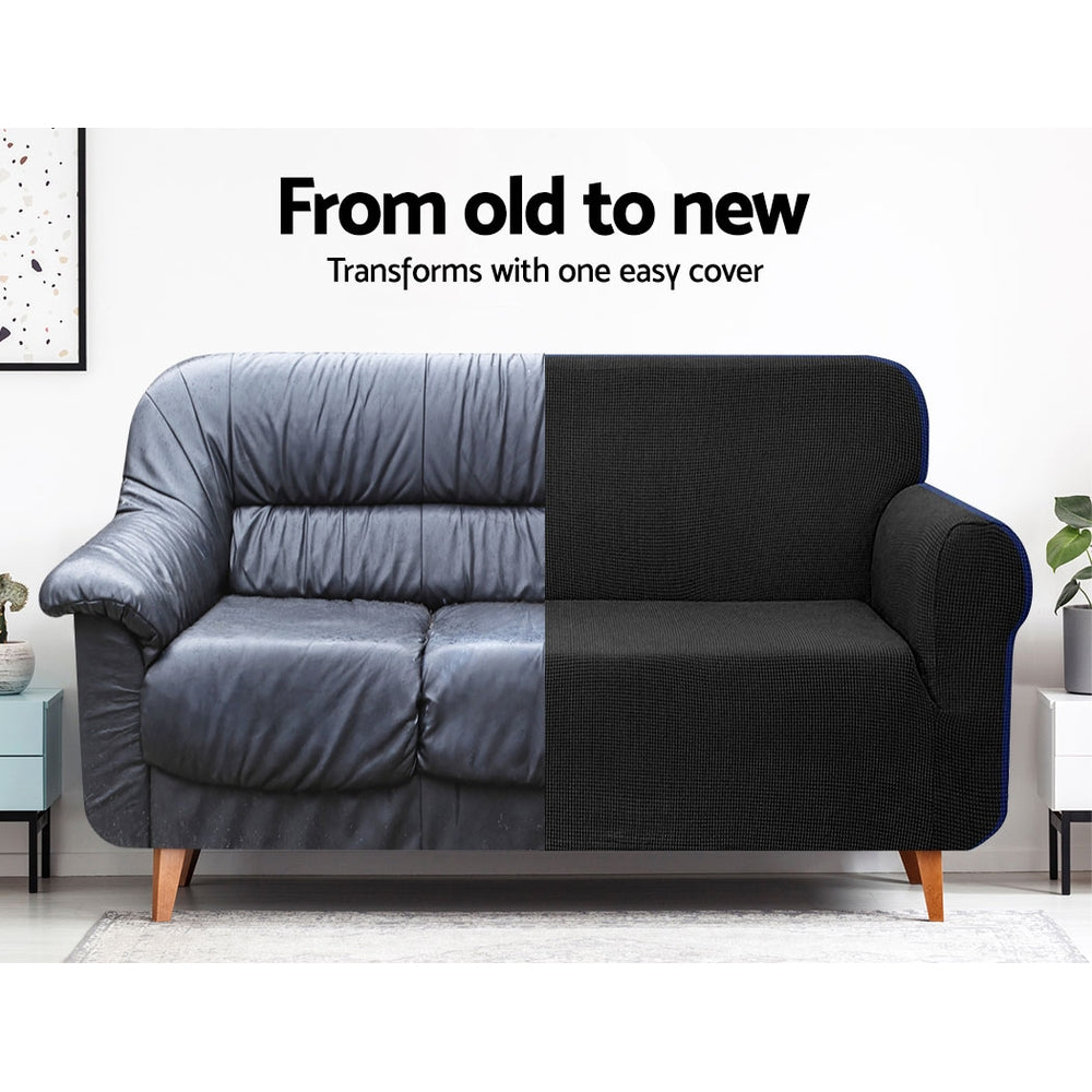 Artiss High Stretch Sofa Cover in black, showcasing its stretchy fabric and snug fit on a three-seater sofa.