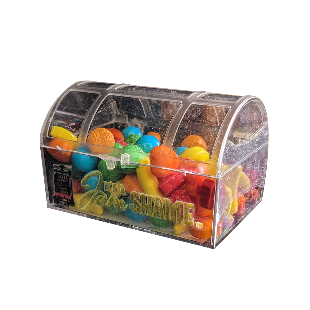 A display of 8 assorted candy crystal boxes shaped like treasure chests, filled with colorful candies including Bananamania, Candy Stars, and more.