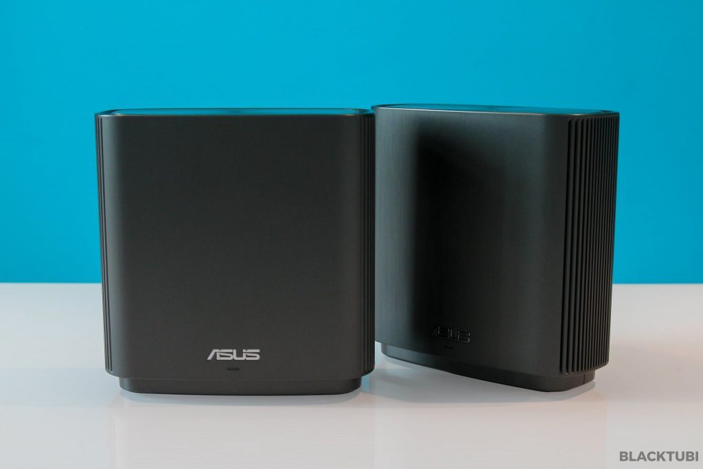 ASUS ZENWIFI CT8 AC3000 Tri-band Whole-Home Mesh WiFi Routers in a modern home setting, showcasing sleek design and advanced technology.