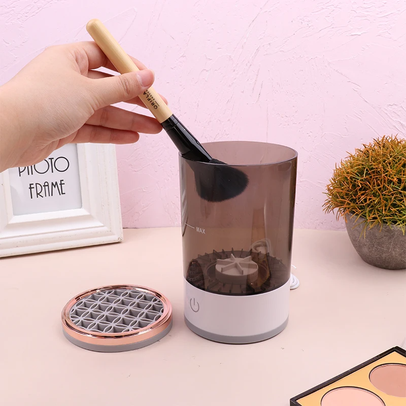 Automatic Brush Cleaner Electric Makeup Brush Cleaning Machine in white and rose gold, designed for fast and effective cleaning of makeup brushes.