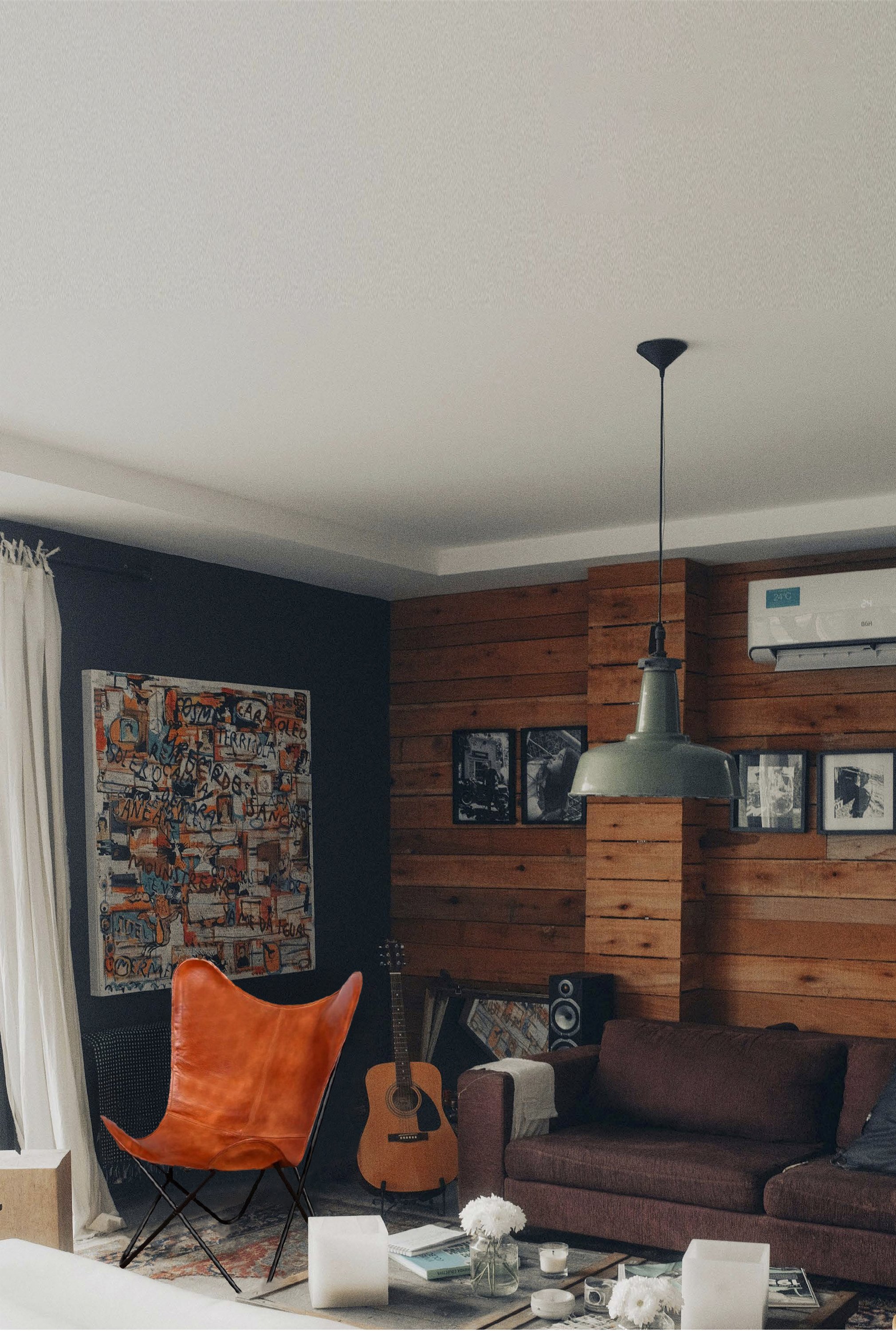 Ava Leather Butterfly Chair in brown featuring a sturdy iron frame and genuine leather seat, perfect for modern decor.