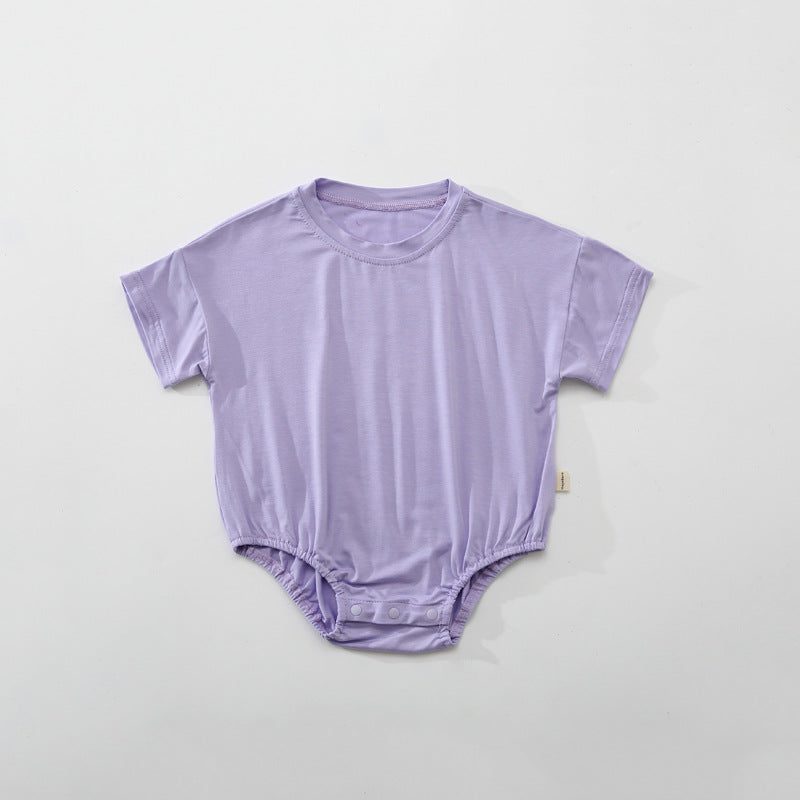 Baby unisex solid color rompers in various colors including pink, blue, green, and yellow, made from soft cotton blend fabric.