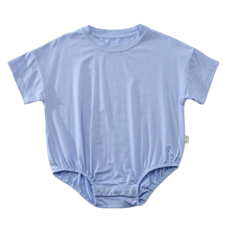 Baby unisex solid color rompers in various colors including pink, blue, green, and yellow, made from soft cotton blend fabric.