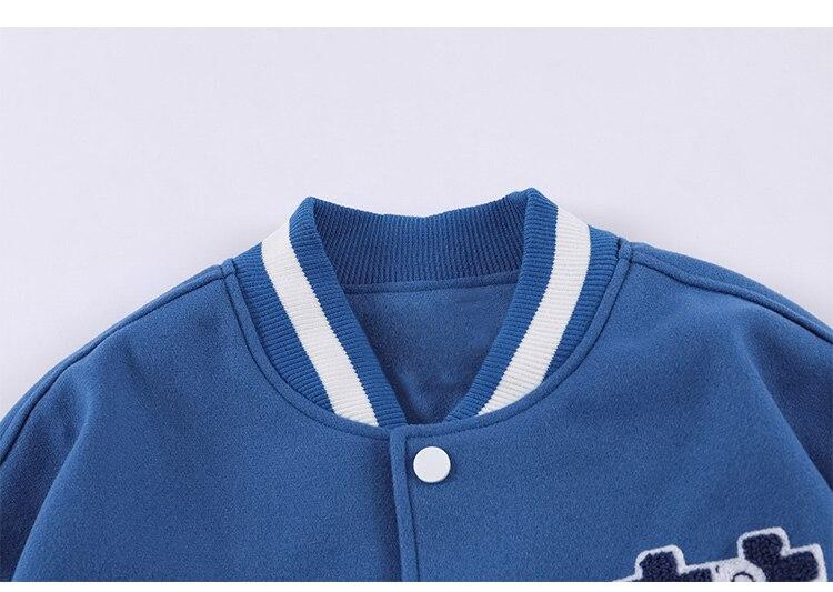 Men's baseball jacket featuring furry bear patchwork embroidery in black, blue, and pinkish red colors, perfect for casual streetwear.