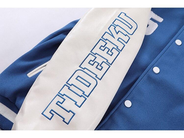 Men's baseball jacket featuring furry bear patchwork embroidery in black, blue, and pinkish red colors, perfect for casual streetwear.