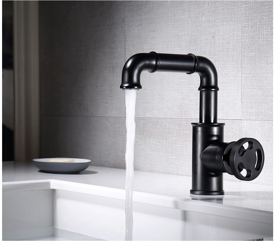 Black brass crane basin faucet with hot and cold water mixer, featuring a contemporary design and single handle for easy operation.