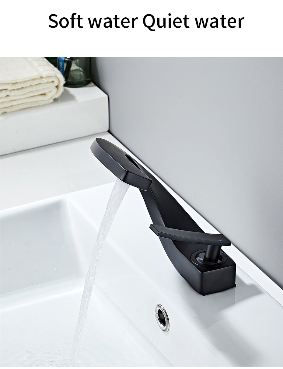Modern brass basin faucet with single handle and sleek design, available in chrome, brushed nickel, and black finishes.