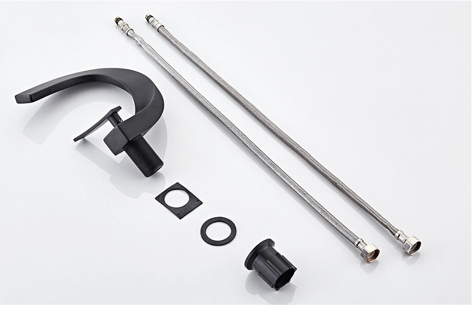 Modern brass basin faucet with single handle and sleek design, available in chrome, brushed nickel, and black finishes.