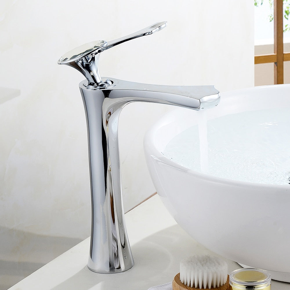 Modern white basin faucet with waterfall spout and single handle, designed for contemporary bathrooms.