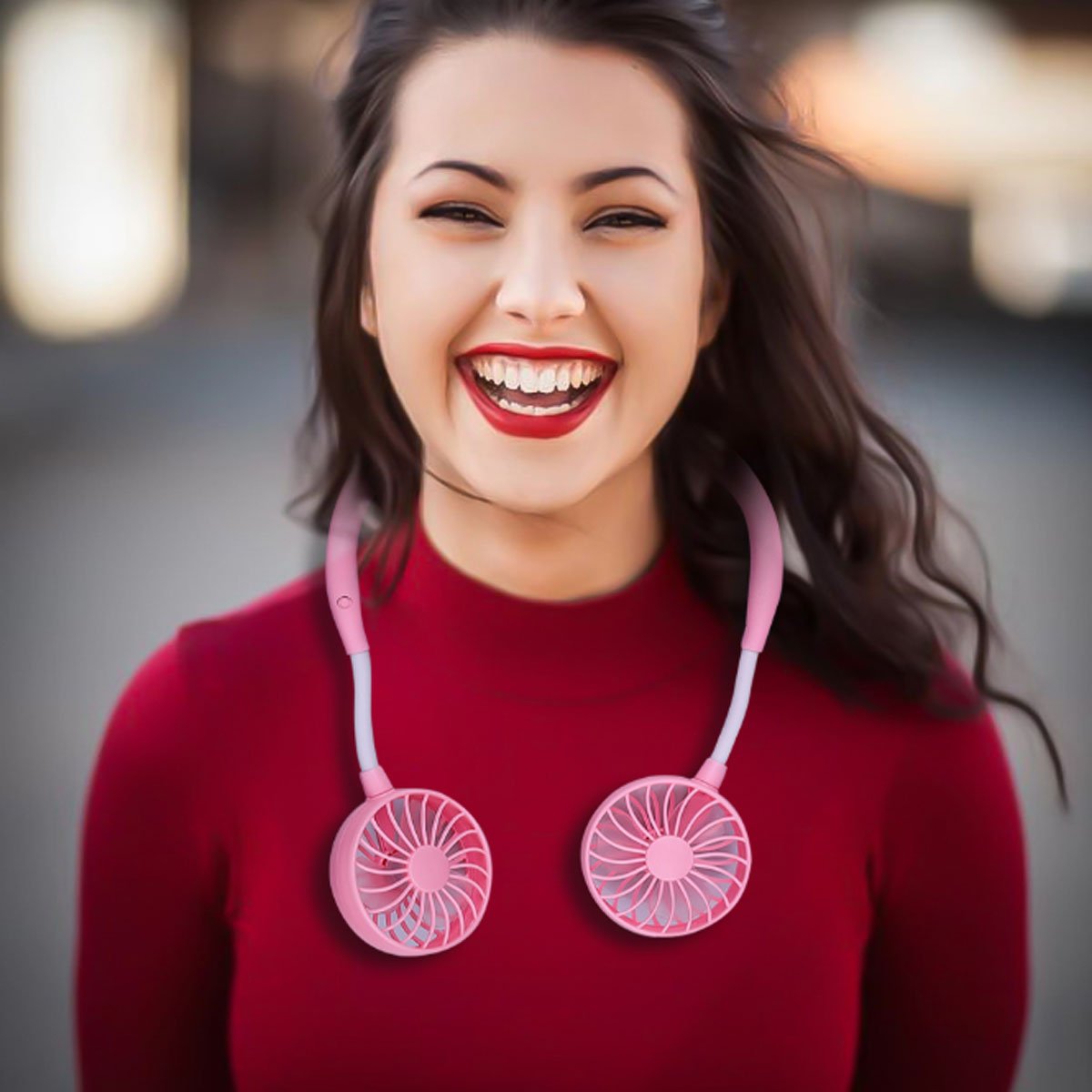 Beat The Heat Double Cool Cordless Breezy Mini Collar Fan worn around the neck, showcasing its sleek design and vibrant colors.