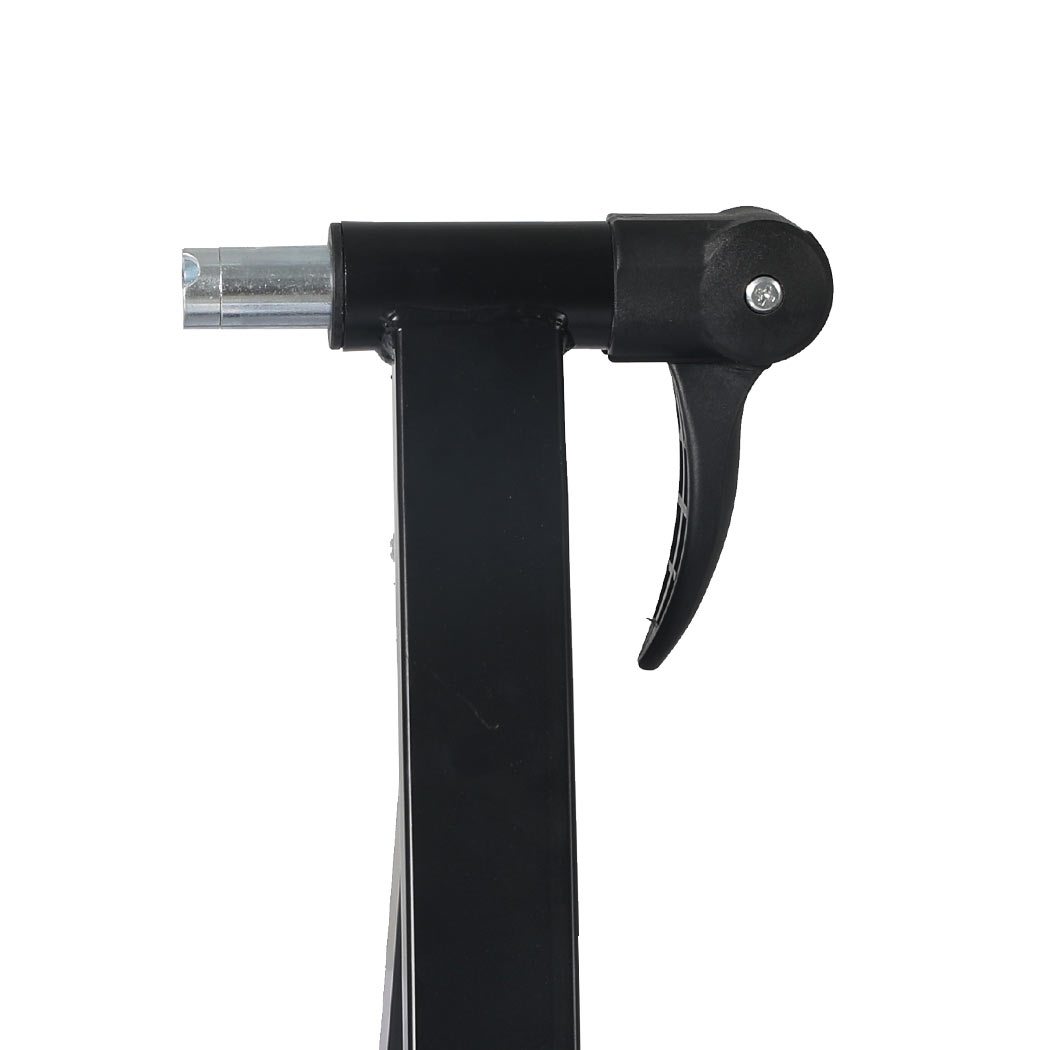 Indoor Bicycle Trainer Stand with heavy-duty steel frame and adjustable footpads, designed for bikes with 26” to 28” wheels.