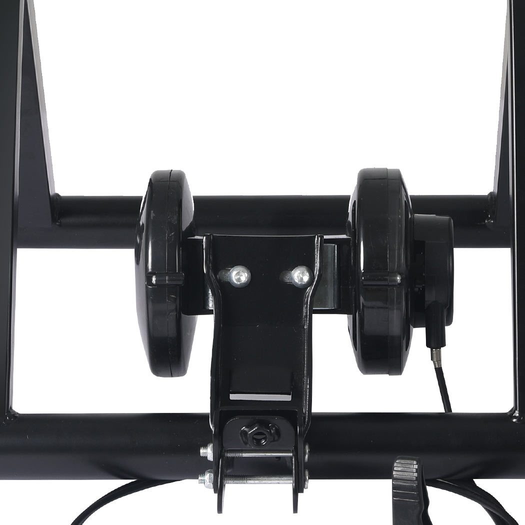 Indoor Bicycle Trainer Stand with heavy-duty steel frame and adjustable footpads, designed for bikes with 26” to 28” wheels.