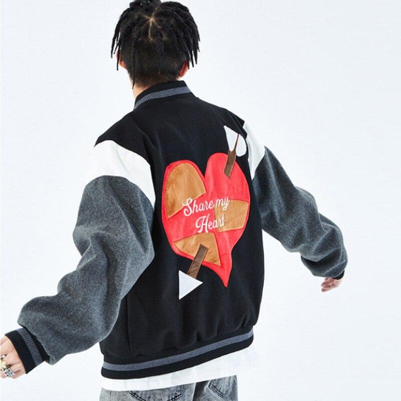 Men's bomber jacket featuring heart-shaped patch and letter embroidery, stylish patchwork design for autumn and winter wear.