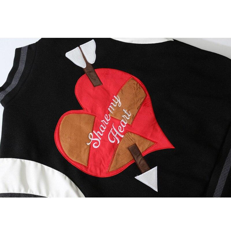 Men's bomber jacket featuring heart-shaped patch and letter embroidery, stylish patchwork design for autumn and winter wear.