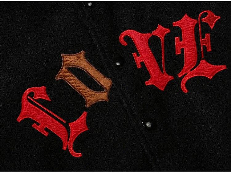 Men's bomber jacket featuring heart-shaped patch and letter embroidery, stylish patchwork design for autumn and winter wear.