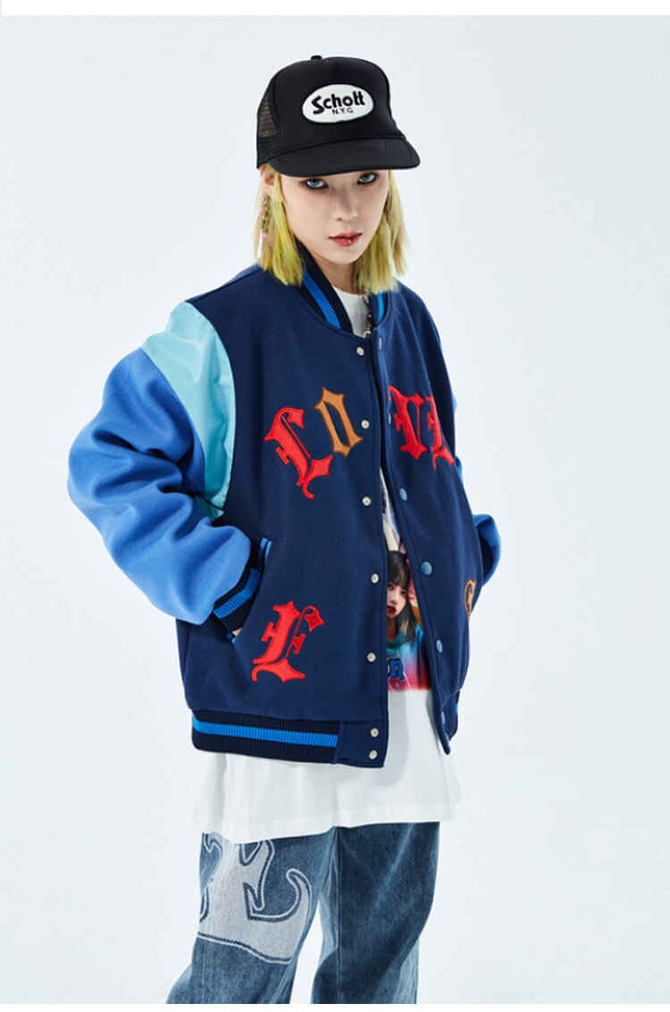 Men's bomber jacket featuring heart-shaped patch and letter embroidery, stylish patchwork design for autumn and winter wear.