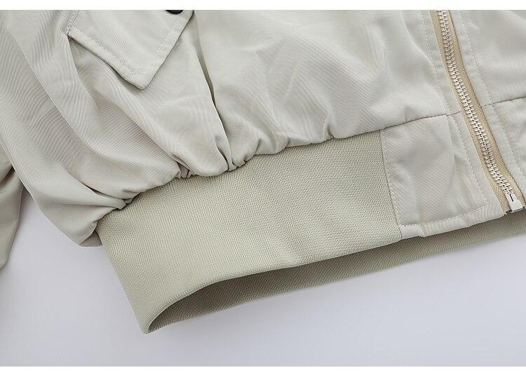 Men's bomber jacket featuring punk letter patches and pleated cargo design, ideal for autumn wear.