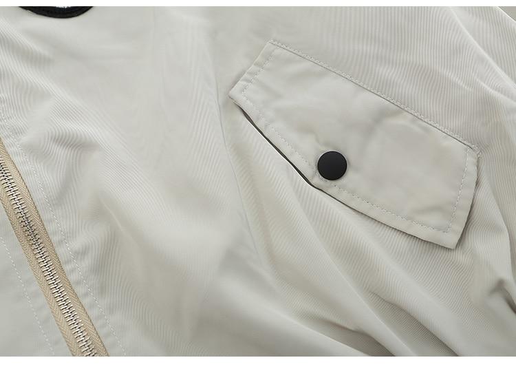 Men's bomber jacket featuring punk letter patches and pleated cargo design, ideal for autumn wear.