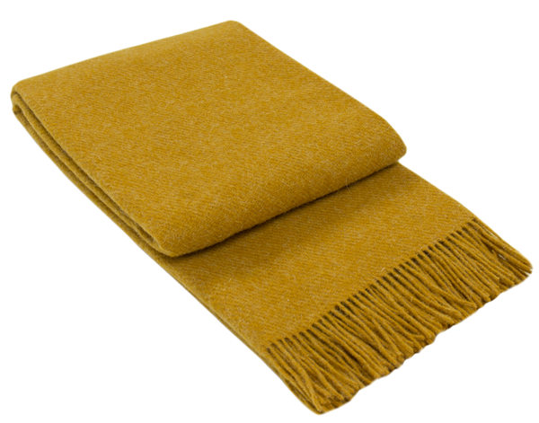 Brighton Throw blanket in mustard color, made from 100% New Zealand wool, showcasing its thick and cozy texture.