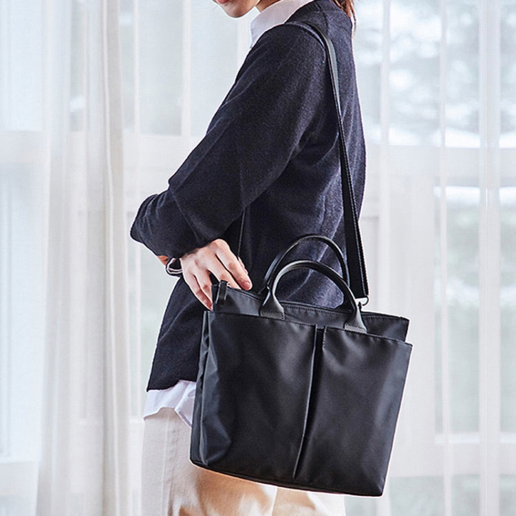 Business Briefcase Handbag in black oxford cloth, showcasing its dual-purpose design and large capacity for files and laptops.
