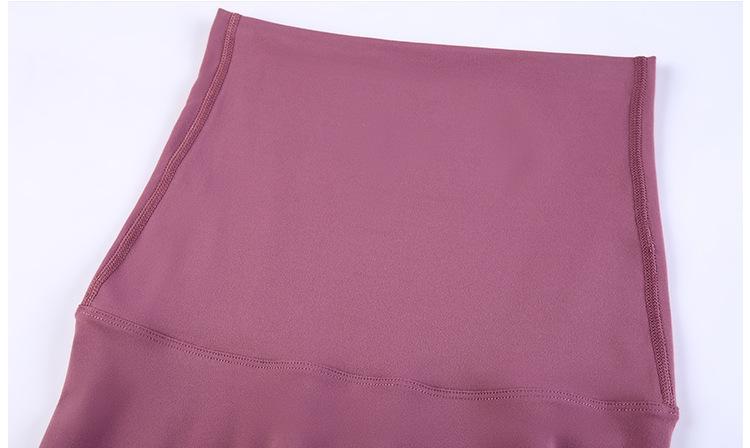 A pair of buttery-soft high rise yoga pants designed for pregnant women, showcasing their stretchy fabric and elastic waist.