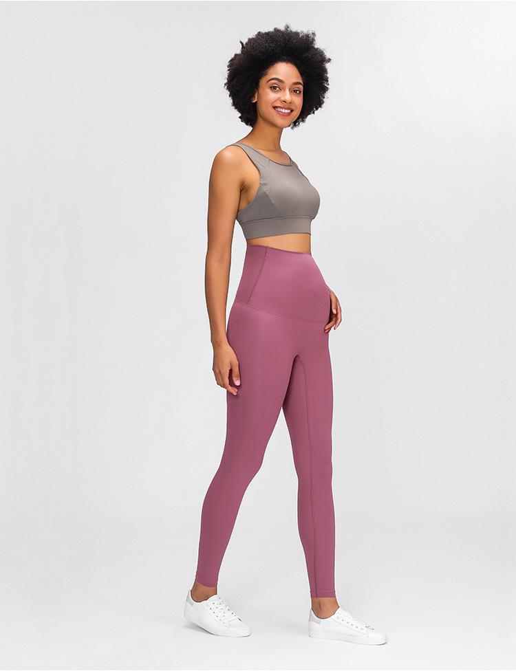A pair of buttery-soft high rise yoga pants designed for pregnant women, showcasing their stretchy fabric and elastic waist.