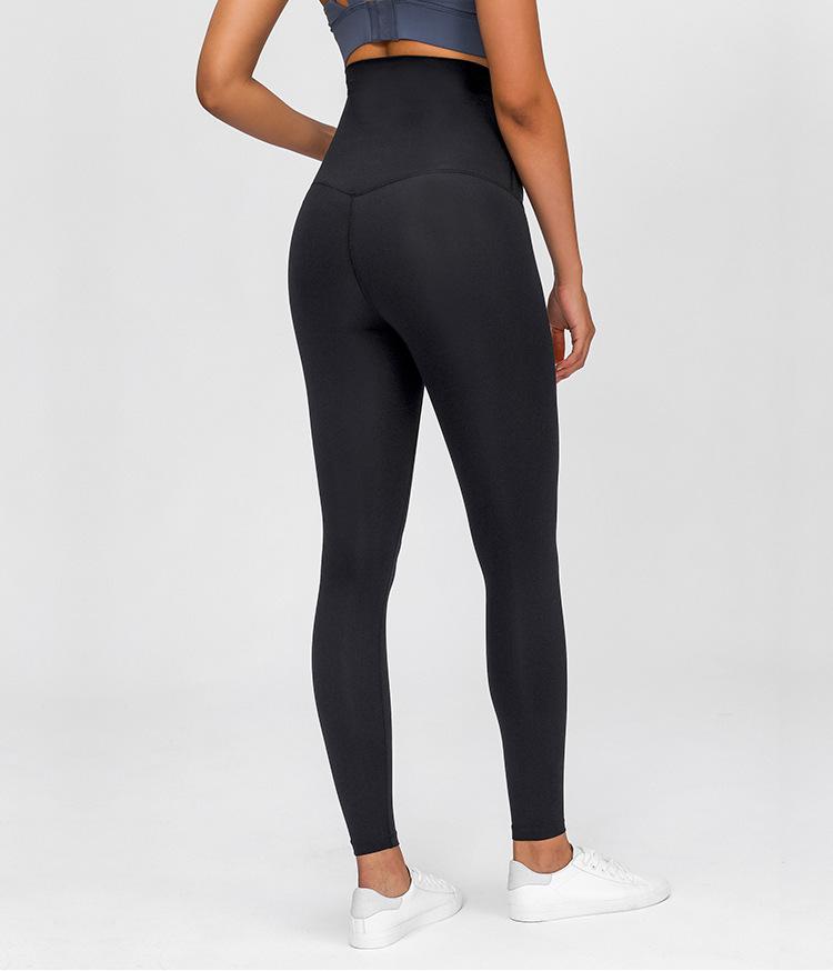 A pair of buttery-soft high rise yoga pants designed for pregnant women, showcasing their stretchy fabric and elastic waist.