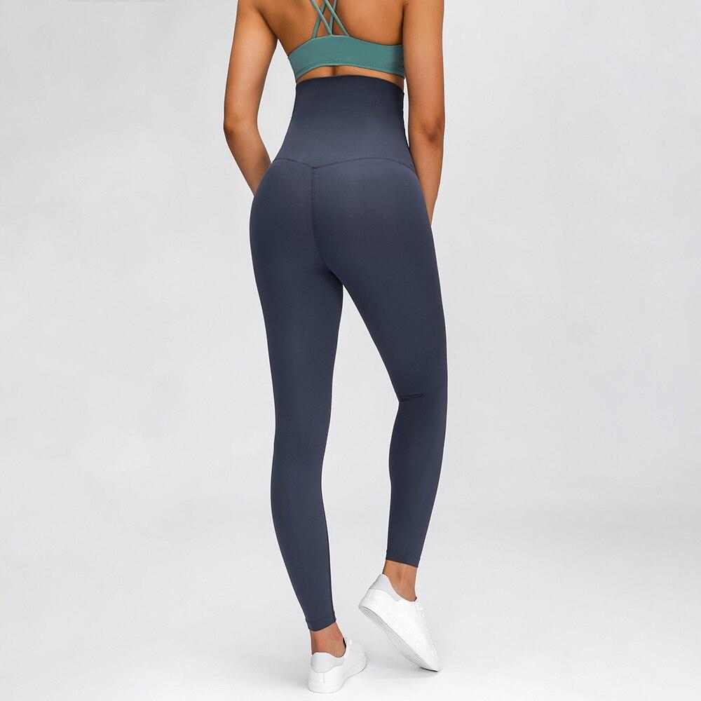 A pair of buttery-soft high rise yoga pants designed for pregnant women, showcasing their stretchy fabric and elastic waist.