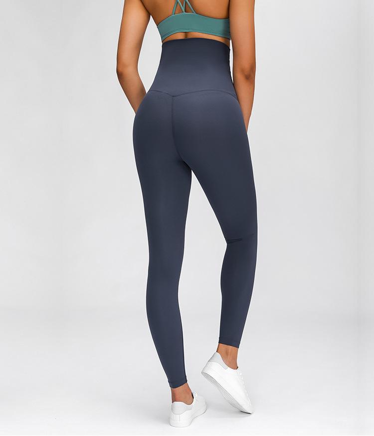 A pair of buttery-soft high rise yoga pants designed for pregnant women, showcasing their stretchy fabric and elastic waist.