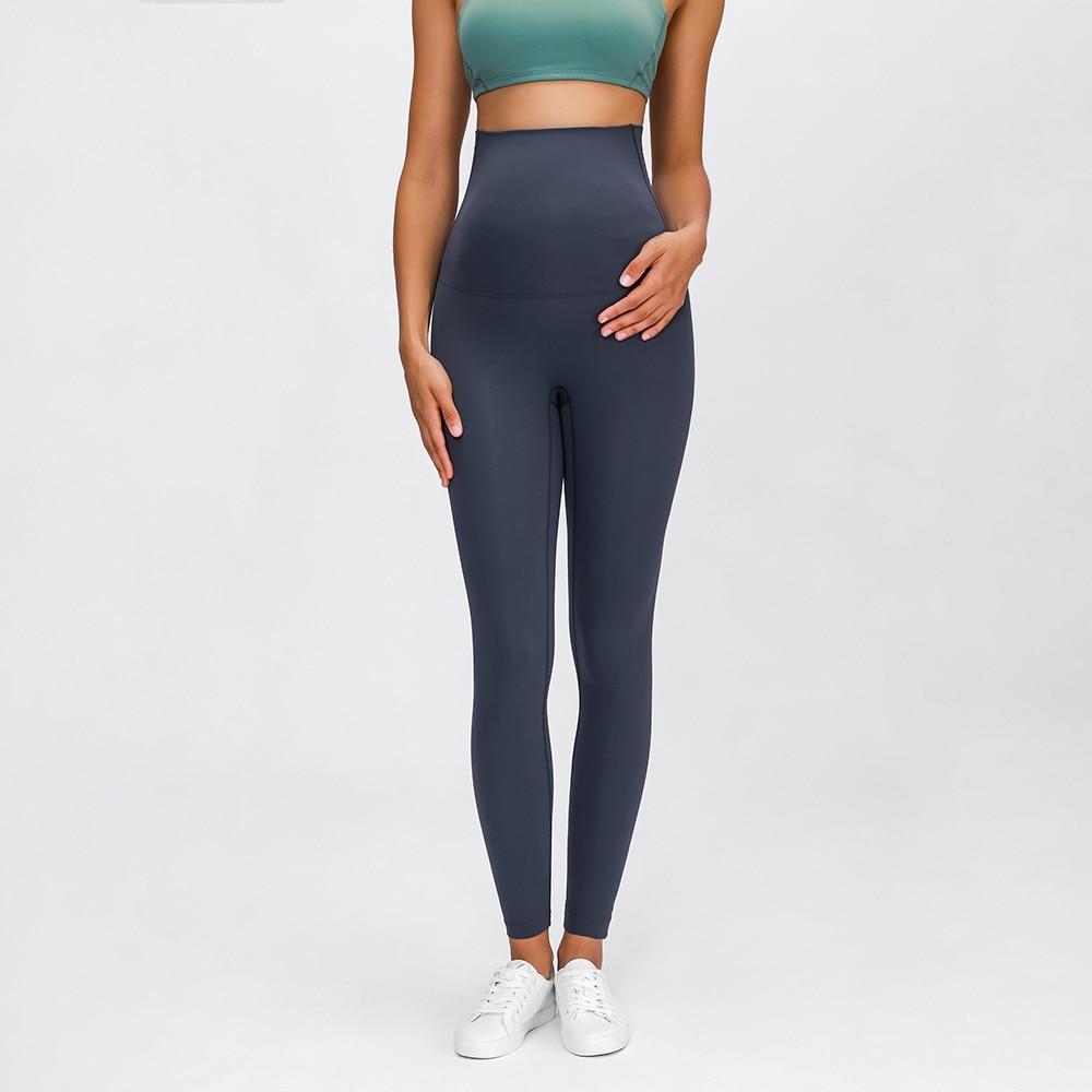 A pair of buttery-soft high rise yoga pants designed for pregnant women, showcasing their stretchy fabric and elastic waist.