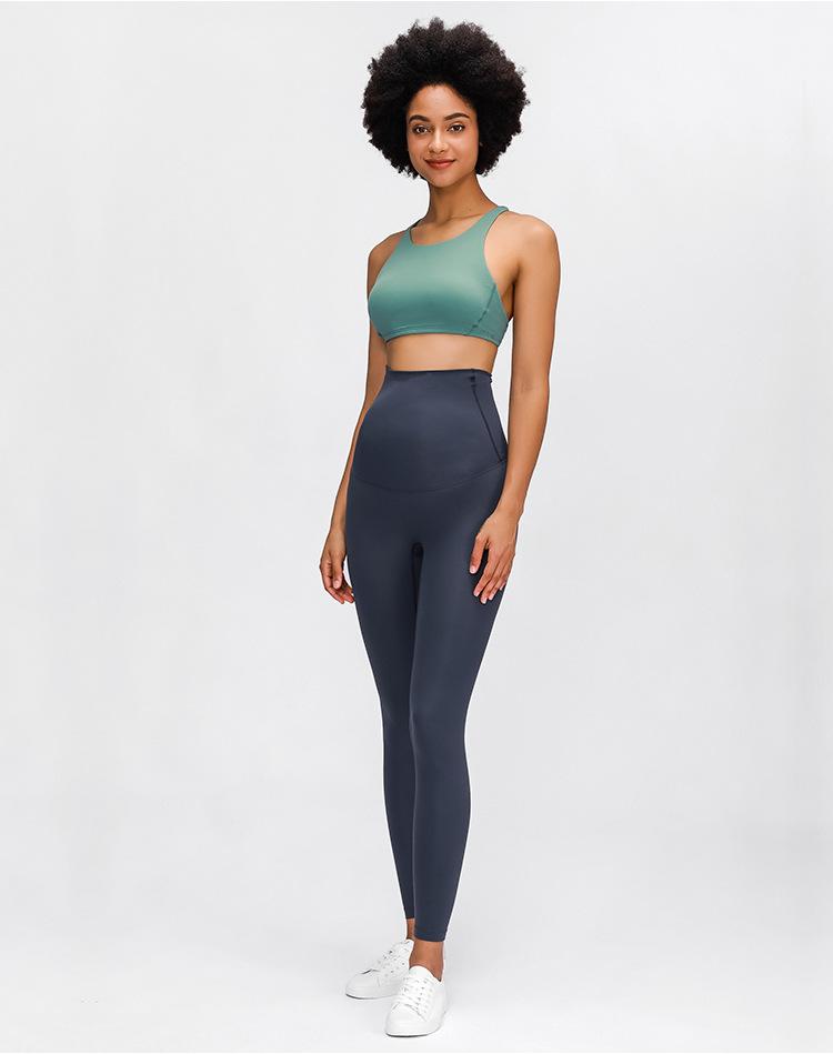 A pair of buttery-soft high rise yoga pants designed for pregnant women, showcasing their stretchy fabric and elastic waist.