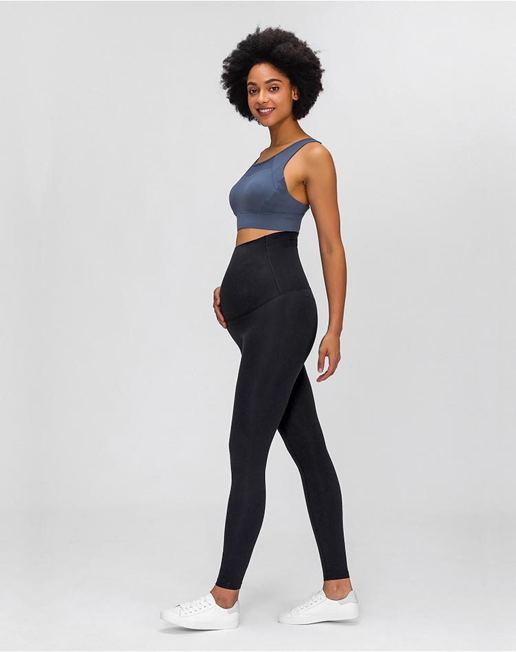 A pair of buttery-soft high rise yoga pants designed for pregnant women, showcasing their stretchy fabric and elastic waist.