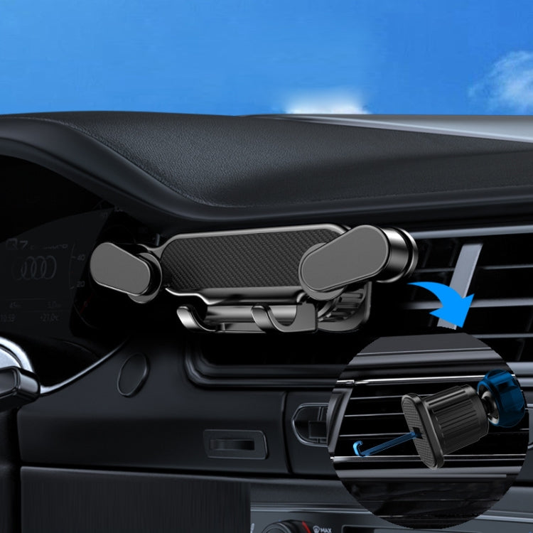 Car Air Vent Gravity Snap Phone Navigation Mount with sun pattern design, securely holding a smartphone in a car air vent.