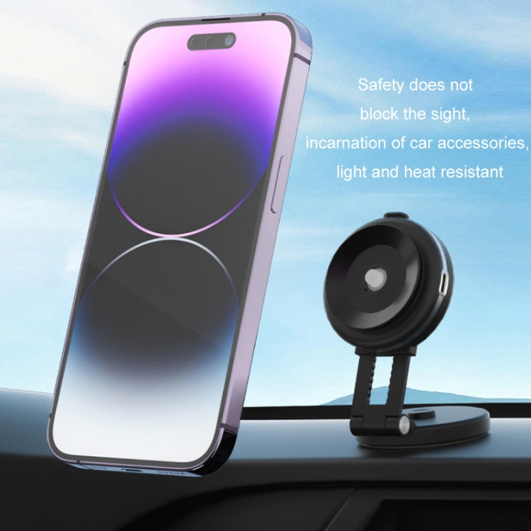Car Electric Vacuum Suction Cup Mobile Phone Holder mounted on a dashboard, securely holding a smartphone with wireless charging feature.