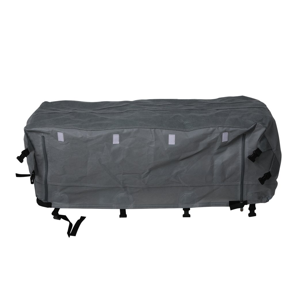 Heavy-duty caravan cover in grey, showcasing 4-layer construction and adjustable straps for secure fit.