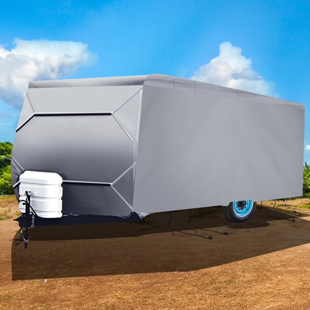 Heavy-duty caravan cover in grey, showcasing 4-layer construction and adjustable straps for secure fit.