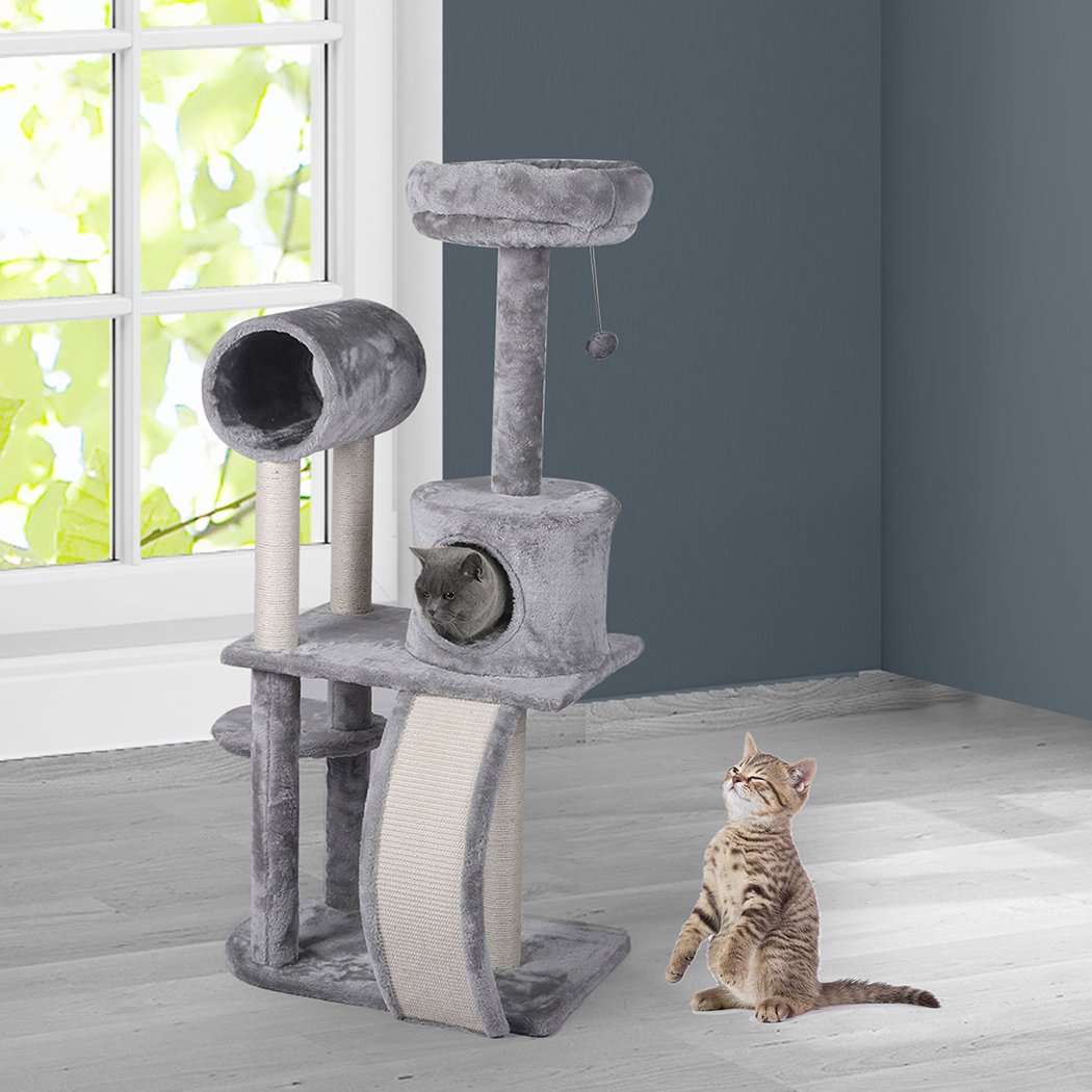 A grey multi-level cat tree tower with plush covering, featuring a scratching post wrapped in sisal and hanging toys for playful cats.