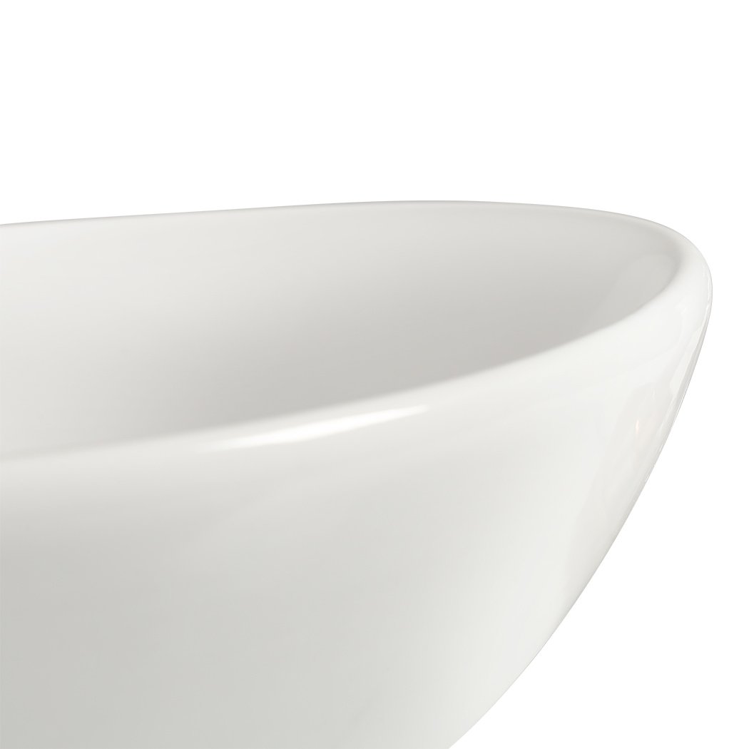 Elegant white ceramic basin for bathroom countertop with high gloss finish and anti-splash design.