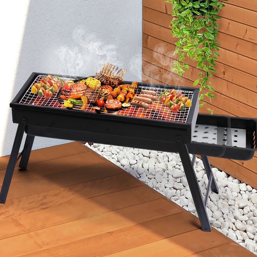 Portable Charcoal BBQ Grill with chrome steel top and air vents, perfect for outdoor cooking and camping.