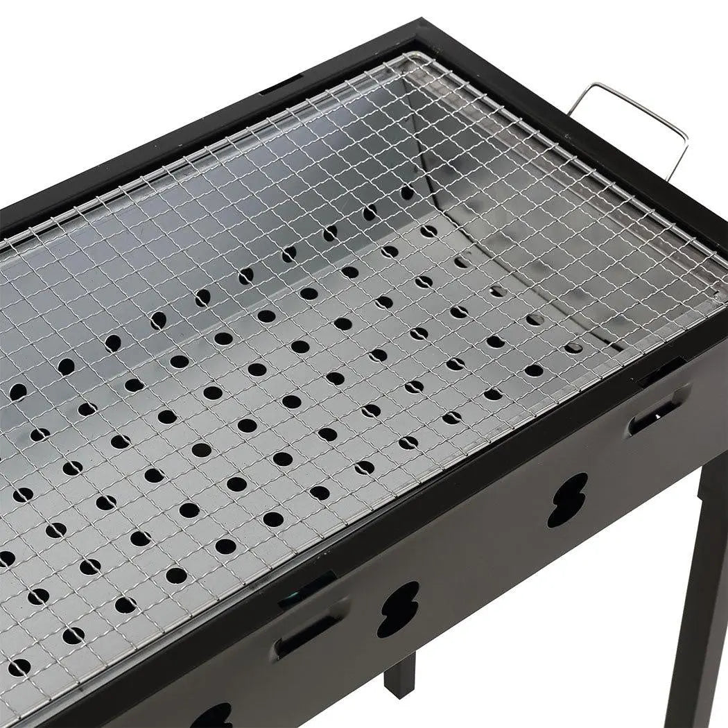 Portable Charcoal BBQ Grill with sturdy legs and handles, ideal for outdoor cooking and camping.