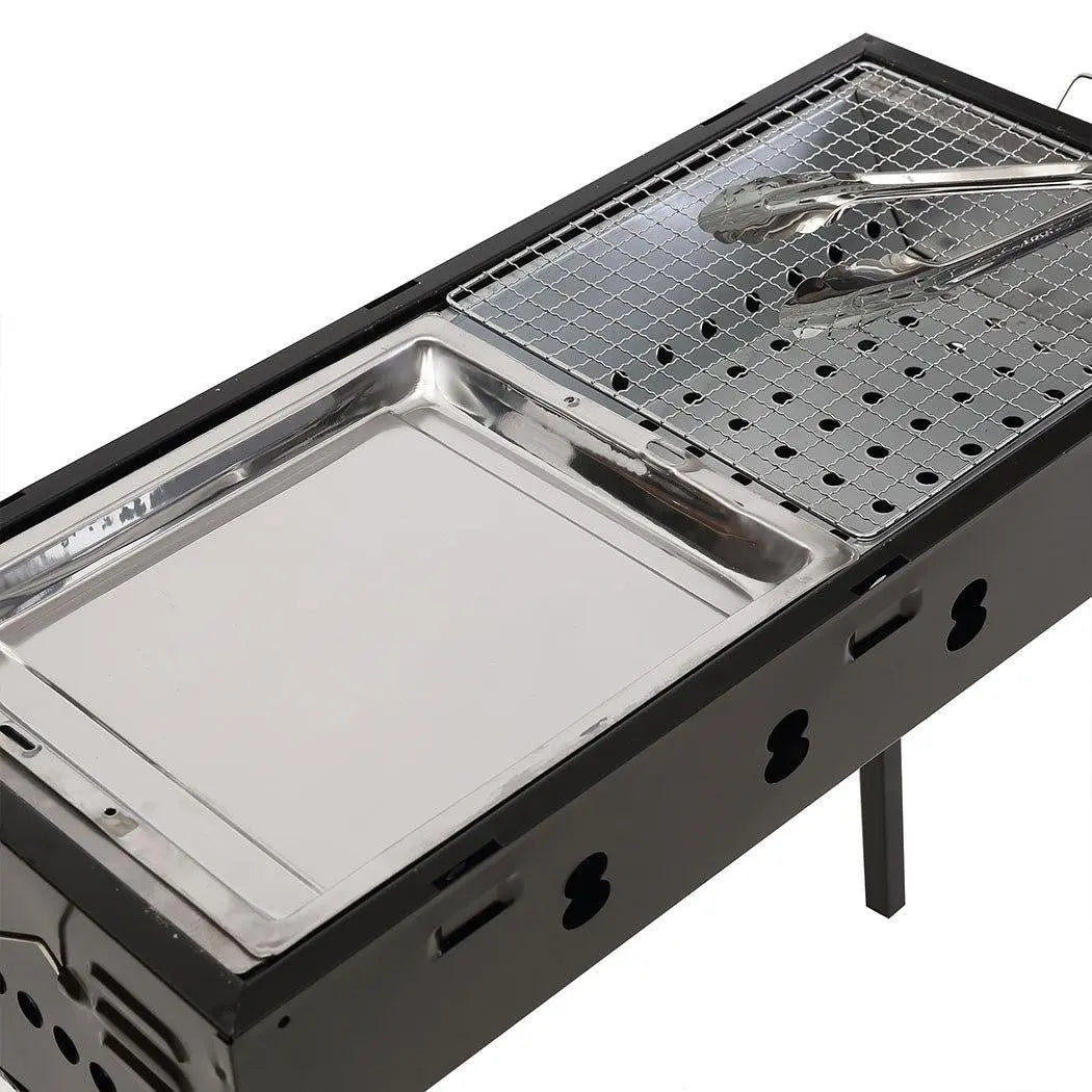 Portable Charcoal BBQ Grill with sturdy legs and handles, ideal for outdoor cooking and camping.