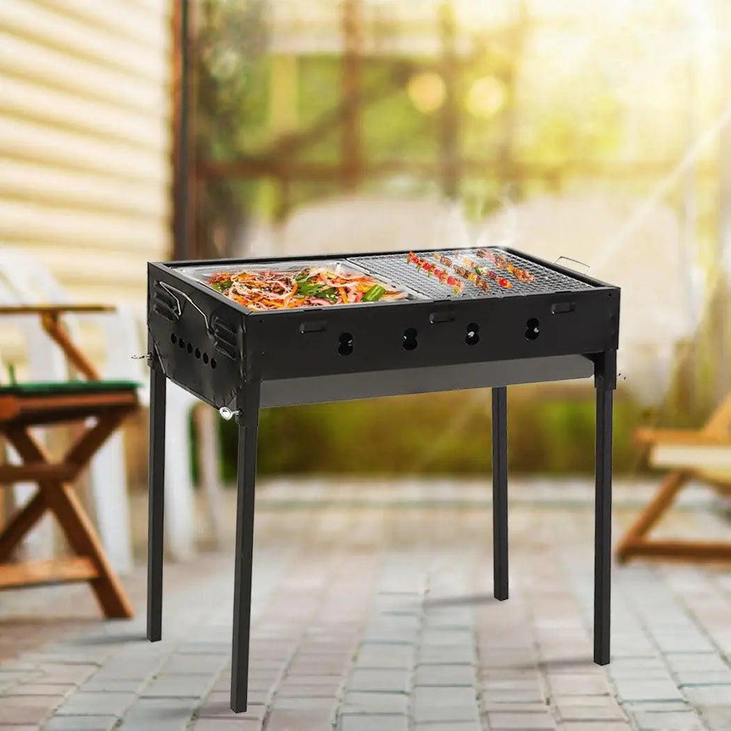 Portable Charcoal BBQ Grill with sturdy legs and handles, ideal for outdoor cooking and camping.